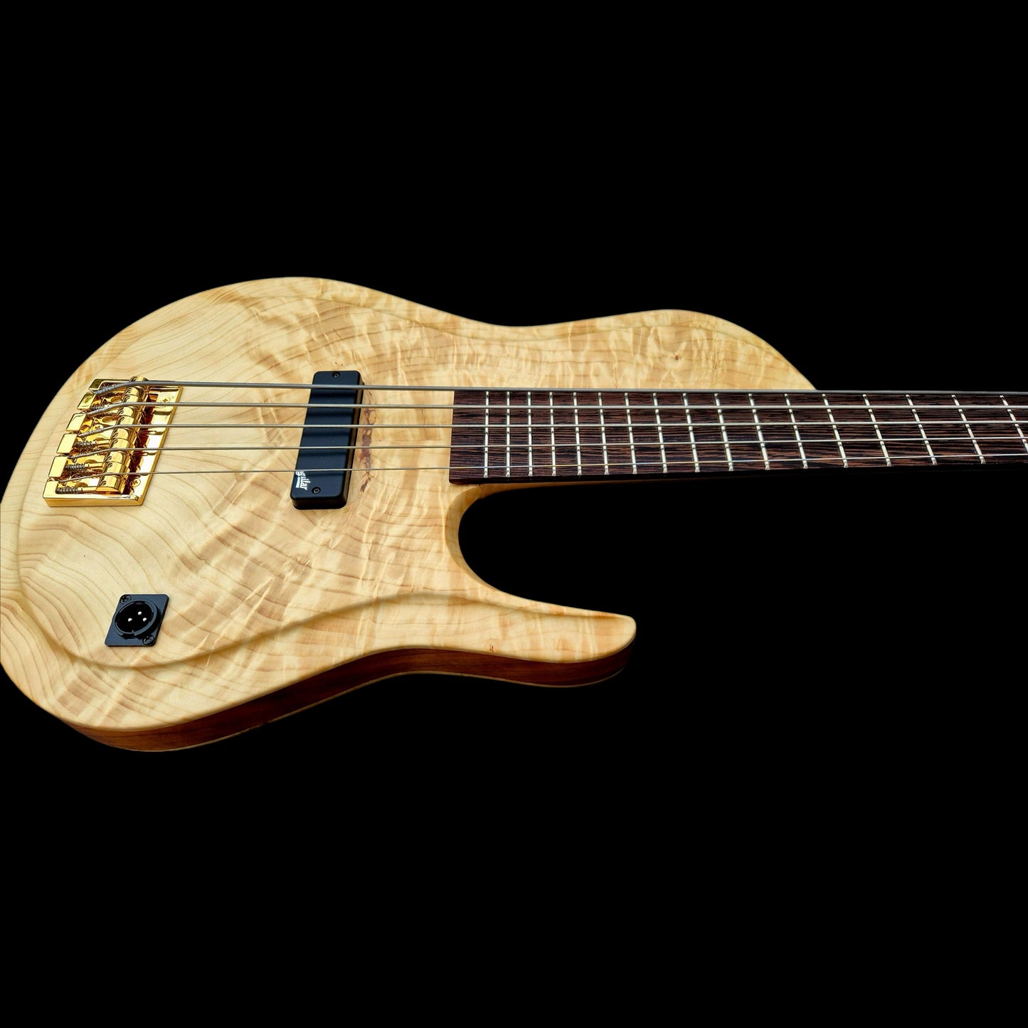 Wooden electric guitar on a black background